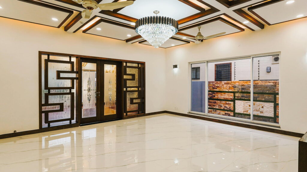 false ceiling design with wooden beams and crystal chandelier for living room in Bangalore home by Wooden Sign Interiors