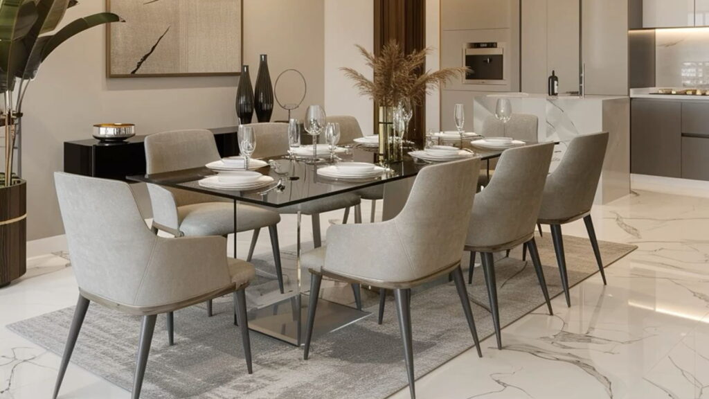 Modern dining room interior design with a glass-top dining table, upholstered chairs, decorative centerpieces, marble flooring, and a contemporary open-plan layout with warm neutral colors.